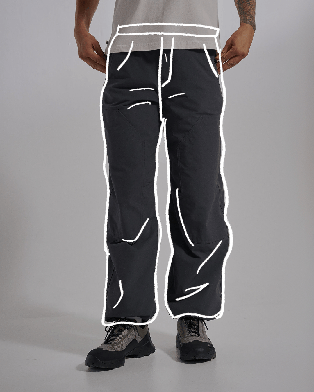 A gif showing loose fit trousers shape illustrated over a studio model wearing different loose fit trousers