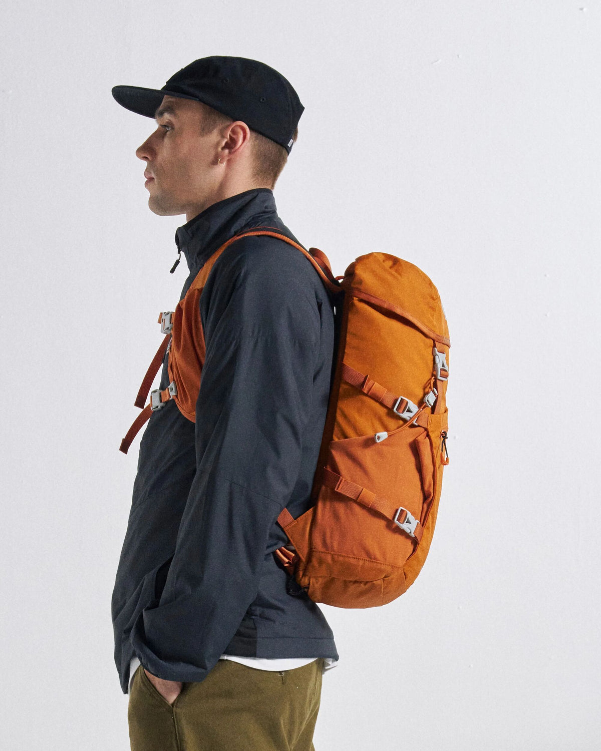 Trailscape 18L Backpack - Sunrise Orange - Studio Model - Male