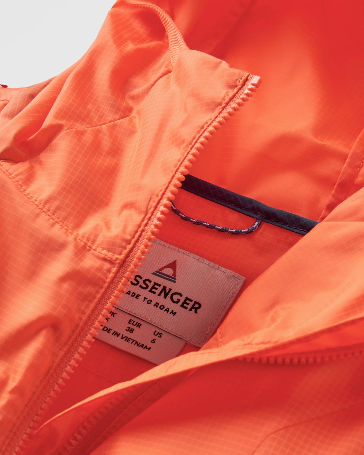 Viento Windshell Anorak - Ember Orange - Flatlay
