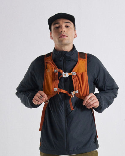 Trailscape 18L Backpack - Sunrise Orange - Studio Model - Male