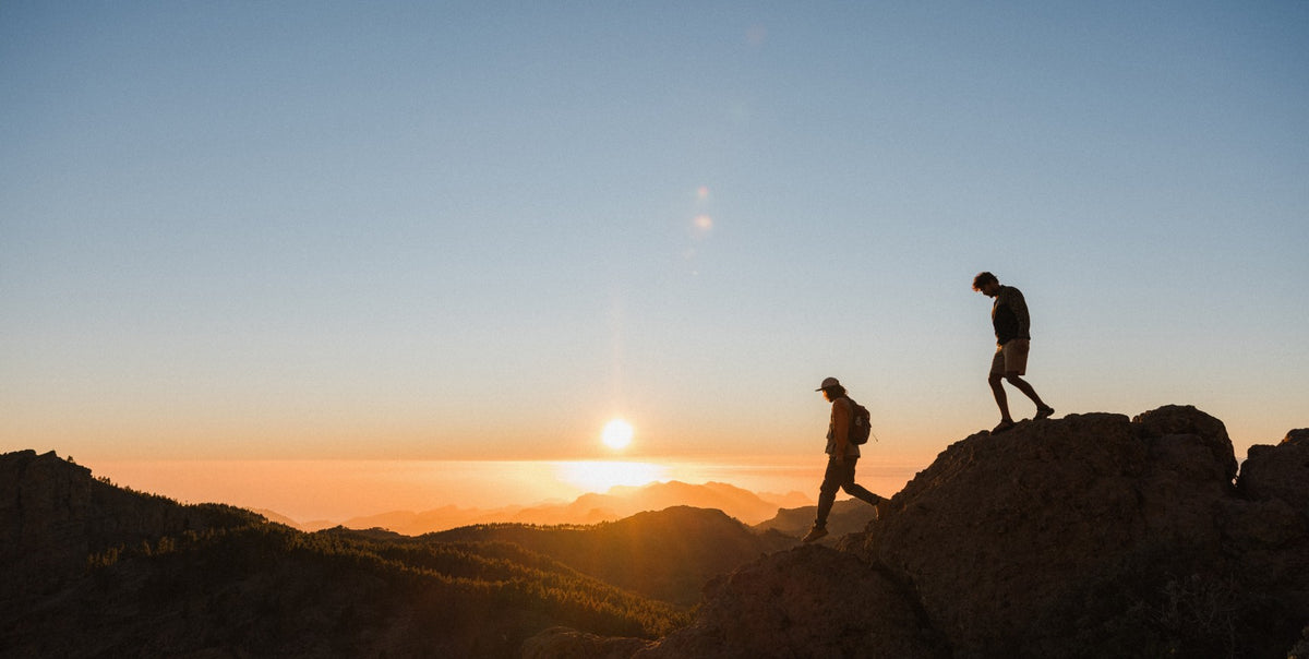 Two hikers on a rocky landscape