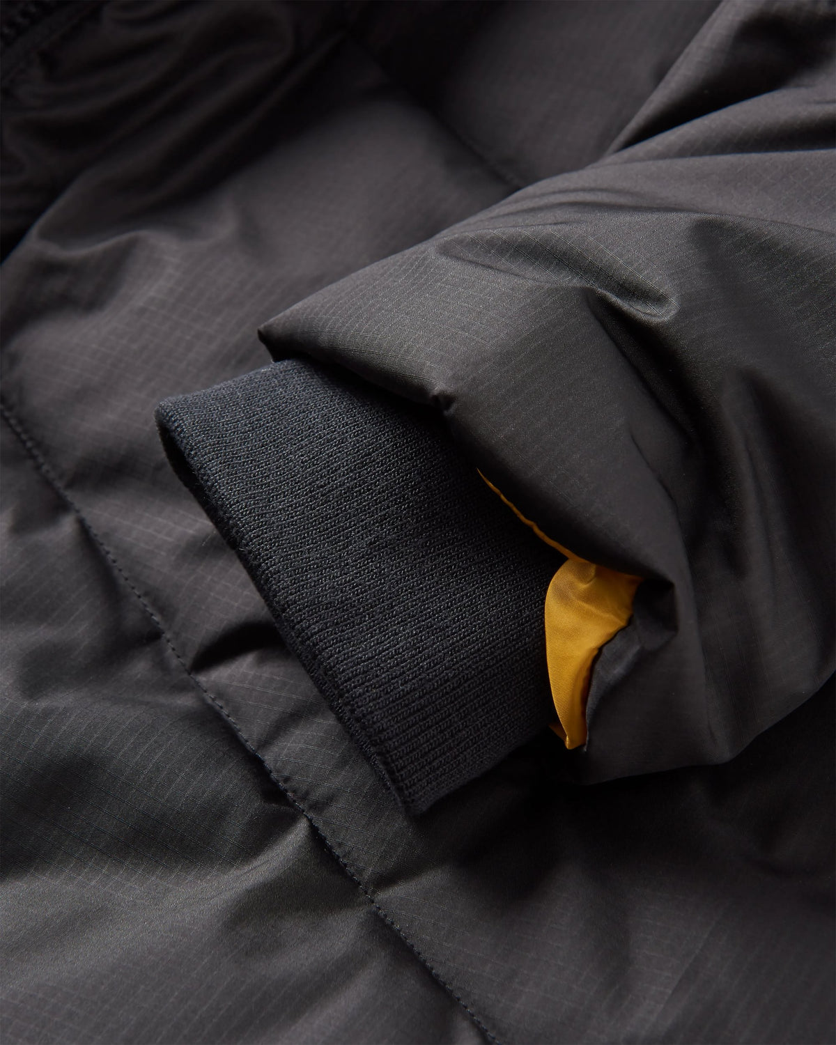 Tasman Long Insulated Jacket - Black - Flatlay