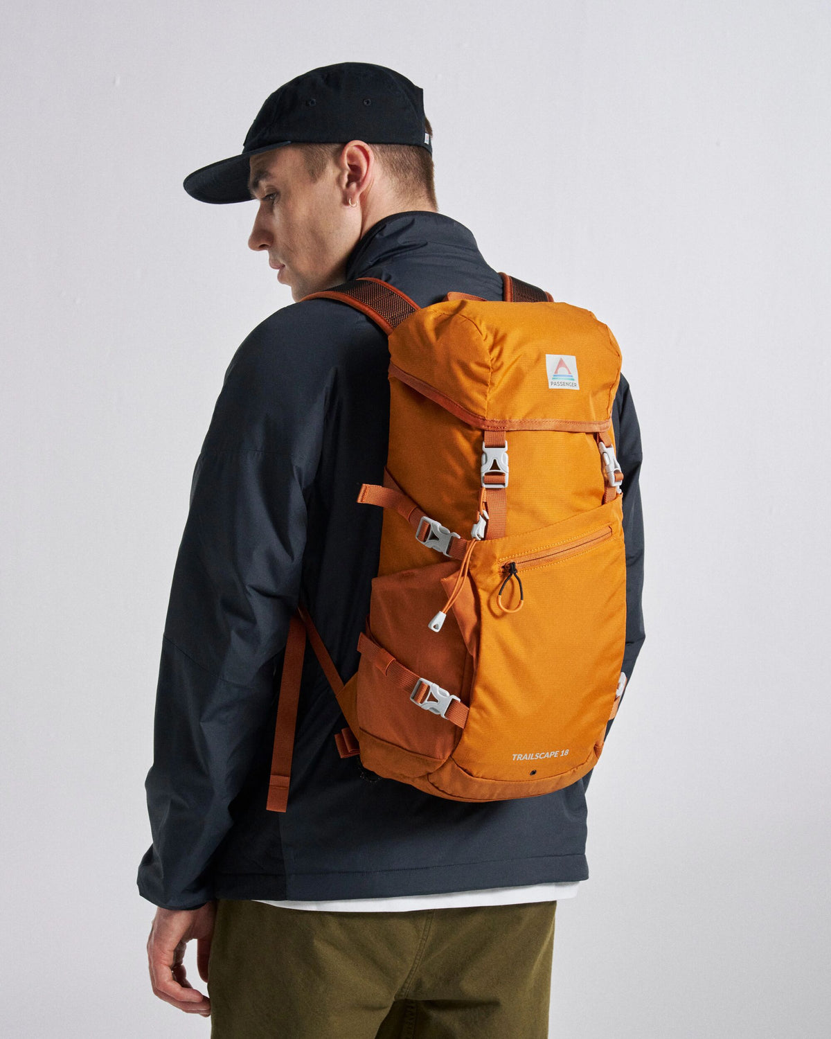 Trailscape 18L Backpack - Sunrise Orange - Studio Model - Male